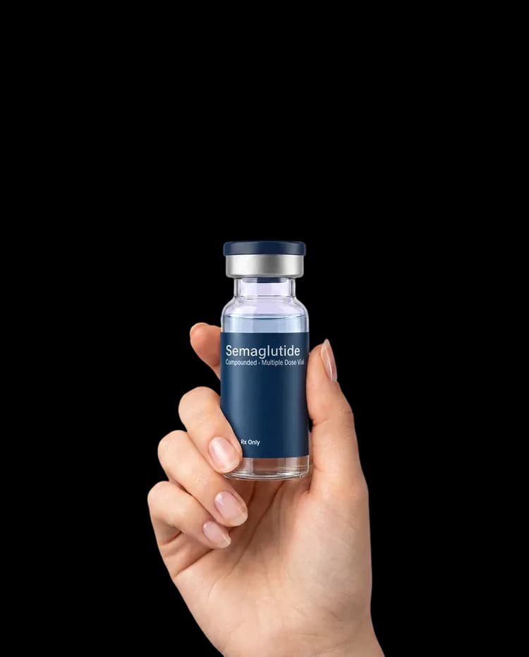 A hand holding a compounded semaglutide vial
