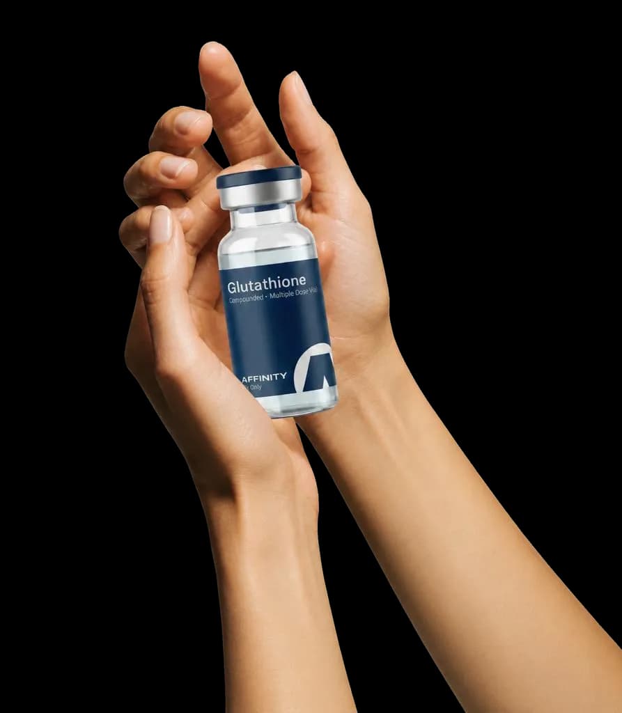 Hands holding an Affinity Glutathione vial
