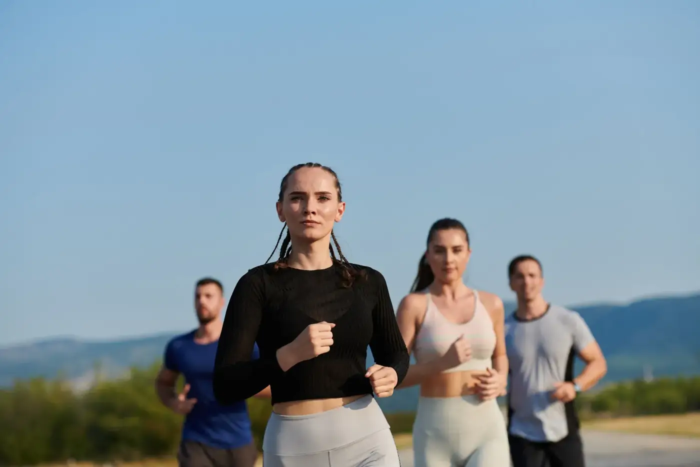 Group of people running outdoors